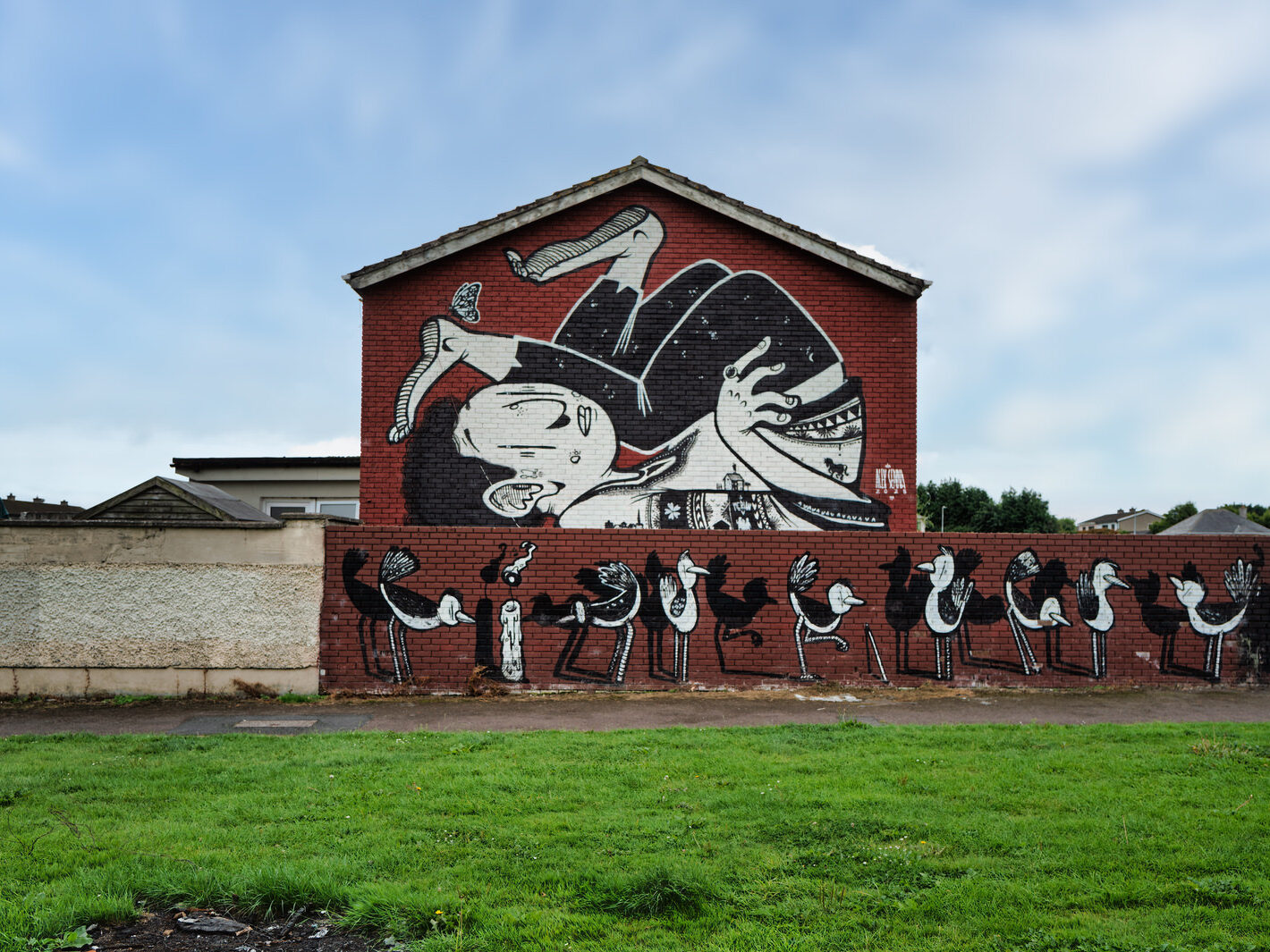 A noteworthy aspect of this mural is its integration of localised details. Senna painted an image of the house itself onto a figure's jumper and included the skyline of Waterford City within the artwork. This inclusion of local elements demonstrates his artistic versatility and his commitment to grounding his universal themes in a specific, personal context.