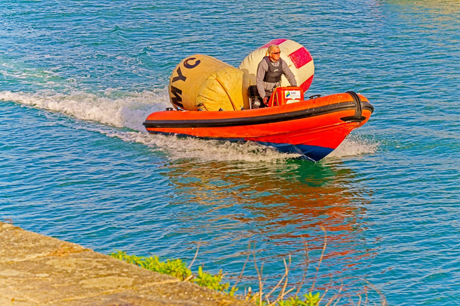 A MAN AND HIS TWO BUOYS IN A RIB [DUN LAOGHAIRE HARBOUR WEST PIER] 004