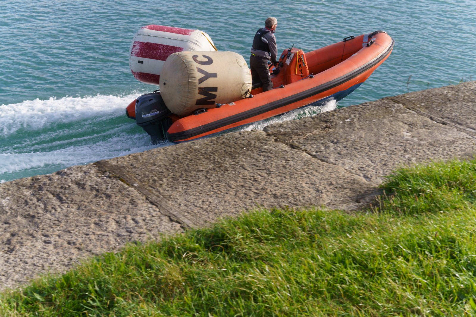 A MAN AND HIS TWO BUOYS IN A RIB [DUN LAOGHAIRE HARBOUR WEST PIER] oo1