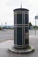 A FREESTANDING FINIAL-TOPPED CAST-IRON TRANSFORMER [DATING FROM 1900 AND LOCATED AT CONQUER HILL ROAD NEAR CLONTARF BUS GARAGE]-244416-1