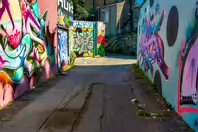 ST PETERS LANE IN PHIBSBOROUGH [BACK IN JULY 2022 IT HOSTED SOME MURALS BUT THE QUALITY WAS IN DECLINE]-244053-1