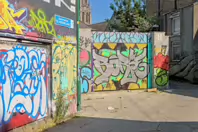 ST PETERS LANE IN PHIBSBOROUGH [BACK IN JULY 2022 IT HOSTED SOME MURALS BUT THE QUALITY WAS IN DECLINE]-244054-1