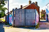 ST PETERS LANE IN PHIBSBOROUGH [BACK IN JULY 2022 IT HOSTED SOME MURALS BUT THE QUALITY WAS IN DECLINE]-244059-1