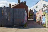 ST PETERS LANE IN PHIBSBOROUGH [BACK IN JULY 2022 IT HOSTED SOME MURALS BUT THE QUALITY WAS IN DECLINE]-244060-1