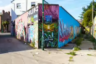 ST PETERS LANE IN PHIBSBOROUGH [BACK IN JULY 2022 IT HOSTED SOME MURALS BUT THE QUALITY WAS IN DECLINE]-244063-1