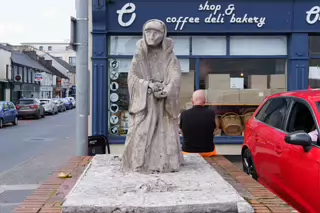 STATUE OF OLD WOMAN