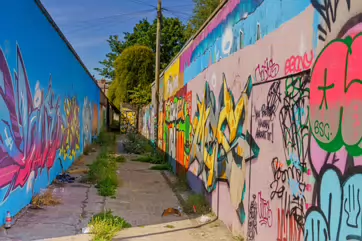 ST PETERS LANE IN PHIBSBOROUGH [BACK IN JULY 2022 IT HOSTED SOME MURALS BUT THE QUALITY WAS IN DECLINE]-244057-1