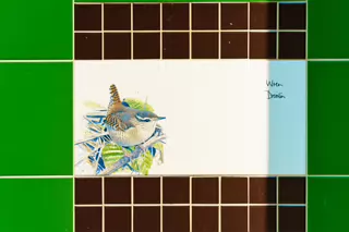 A SET OF THREE TILES FEATURING THE WREN AND THE GOLDCREST [BY KILLIAN MULLARNEY]-239287-1