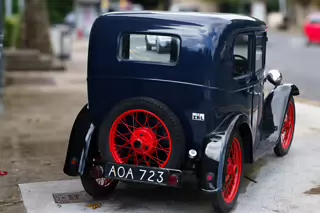 I WONDER IF MY CAR HAS ANY TRADE IN VALUE [OLD BABY AUSTIN CAR PARKED AT THE DROPPING WELL PUB]-239257-1