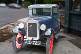 I WONDER IF MY CAR HAS ANY TRADE IN VALUE [OLD BABY AUSTIN CAR PARKED AT THE DROPPING WELL PUB]-239258-1