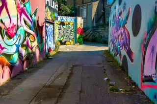 ST PETERS LANE IN PHIBSBOROUGH [BACK IN JULY 2022 IT HOSTED SOME MURALS BUT THE QUALITY WAS IN DECLINE]-244053-1