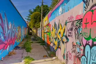 ST PETERS LANE IN PHIBSBOROUGH [BACK IN JULY 2022 IT HOSTED SOME MURALS BUT THE QUALITY WAS IN DECLINE]-244057-1
