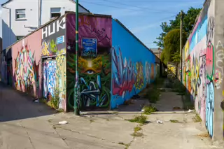 ST PETERS LANE IN PHIBSBOROUGH [BACK IN JULY 2022 IT HOSTED SOME MURALS BUT THE QUALITY WAS IN DECLINE]-244062-1