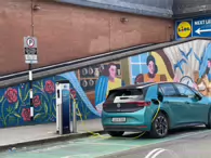 MURAL BY CLAIRE PROUVOST ON THE REDUNDANT MOVING WALKWAY [ENTRANCE TO THE ORIGINAL AND FIRST SHOPPING CENTRE IN DUNDRUM]-231552-1