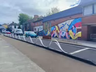 MURAL BY CLAIRE PROUVOST ON THE REDUNDANT MOVING WALKWAY [ENTRANCE TO THE ORIGINAL AND FIRST SHOPPING CENTRE IN DUNDRUM]-231554-1