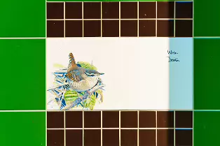A SET OF THREE TILES FEATURING THE WREN AND THE GOLDCREST [BY KILLIAN MULLARNEY]-239287-1