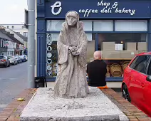 STATUE OF OLD WOMAN