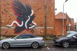 EXAMPLES OF STREET ART BY DANK AND SABEK [ON THE RED BRICK WALL ON TALBOT STREET IN BELFAST]-235444-1 MURAL ON TALBOT STREET