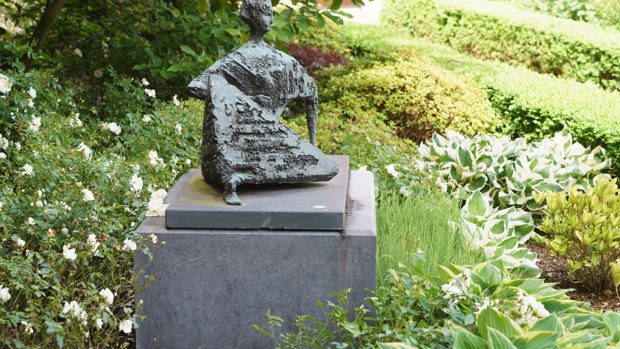 RECLINING FIGURE This striking bronze sculpture, "Reclining Figure", by Frederick Edward McWilliam (1909-1992), was relocated in 2013...