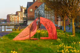 A RED METAL YOKE BY BOB SLOAN [THIS SCULPTURE IN BELFAST HAS NO NAME]-203534-1