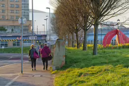 A RED METAL YOKE BY BOB SLOAN [THIS SCULPTURE IN BELFAST HAS NO NAME]-203539-1