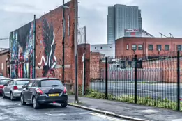 EXAMPLES OF STREET ART BY DANK AND SABEK [ON THE RED BRICK WALL ON TALBOT STREET IN BELFAST]-235447-1