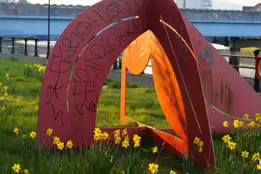 A RED METAL YOKE BY BOB SLOAN [THIS SCULPTURE IN BELFAST HAS NO NAME]-203536-1