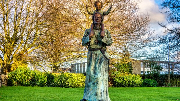 SAINT CONLETH'S STATUE In August 2024 when I photographed this sculpture and garden the statue portrayed the saint with a child perched upon...