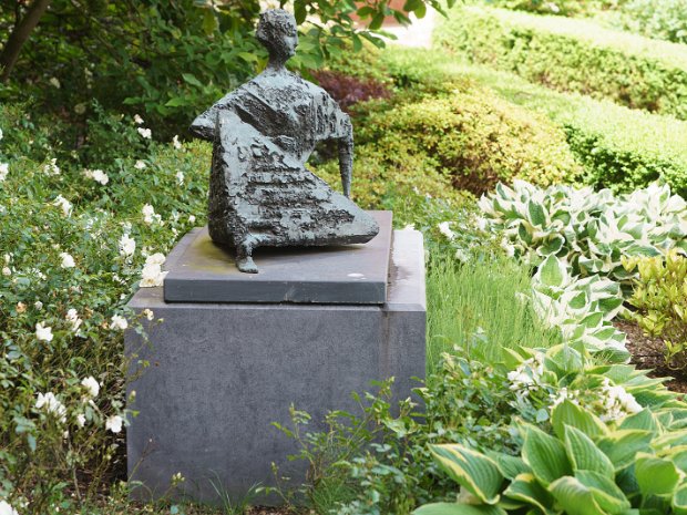 RECLINING FIGURE This striking bronze sculpture, "Reclining Figure", by Frederick Edward McWilliam (1909-1992), was relocated in 2013...