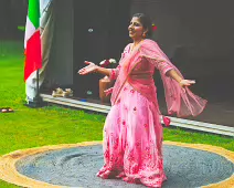 PERFORMING IN THE RAIN IN A BEAUTIFUL PINK DRESS [RAINDROPS ARE VISIBLE IN SOME PHOTOGRAPHS]-235637-1