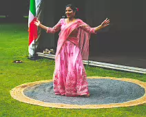 PERFORMING IN THE RAIN IN A BEAUTIFUL PINK DRESS [RAINDROPS ARE VISIBLE IN SOME PHOTOGRAPHS]-235639-1