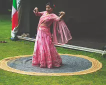 PERFORMING IN THE RAIN IN A BEAUTIFUL PINK DRESS [RAINDROPS ARE VISIBLE IN SOME PHOTOGRAPHS]-235642-1