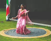 PERFORMING IN THE RAIN IN A BEAUTIFUL PINK DRESS [RAINDROPS ARE VISIBLE IN SOME PHOTOGRAPHS]-235643-1