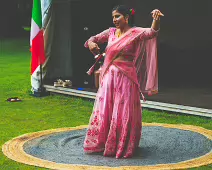 PERFORMING IN THE RAIN IN A BEAUTIFUL PINK DRESS [RAINDROPS ARE VISIBLE IN SOME PHOTOGRAPHS]-235644-1