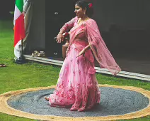 PERFORMING IN THE RAIN IN A BEAUTIFUL PINK DRESS [RAINDROPS ARE VISIBLE IN SOME PHOTOGRAPHS]-235645-1