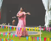 PERFORMING IN THE RAIN IN A BEAUTIFUL PINK DRESS [RAINDROPS ARE VISIBLE IN SOME PHOTOGRAPHS]-235646-1