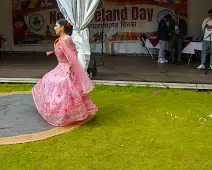 PERFORMING IN THE RAIN IN A BEAUTIFUL PINK DRESS [RAINDROPS ARE VISIBLE IN SOME PHOTOGRAPHS]-235649-1