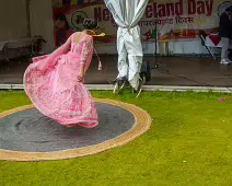 PERFORMING IN THE RAIN IN A BEAUTIFUL PINK DRESS [RAINDROPS ARE VISIBLE IN SOME PHOTOGRAPHS]-235651-1