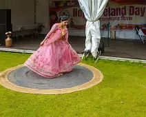 PERFORMING IN THE RAIN IN A BEAUTIFUL PINK DRESS [RAINDROPS ARE VISIBLE IN SOME PHOTOGRAPHS]-235652-1