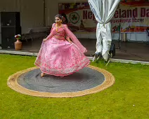 PERFORMING IN THE RAIN IN A BEAUTIFUL PINK DRESS [RAINDROPS ARE VISIBLE IN SOME PHOTOGRAPHS]-235653-1