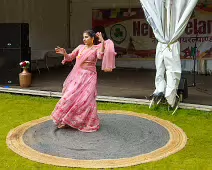 PERFORMING IN THE RAIN IN A BEAUTIFUL PINK DRESS [RAINDROPS ARE VISIBLE IN SOME PHOTOGRAPHS]-235654-1