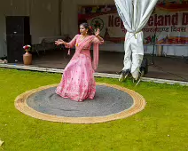 PERFORMING IN THE RAIN IN A BEAUTIFUL PINK DRESS [RAINDROPS ARE VISIBLE IN SOME PHOTOGRAPHS]-235656-1