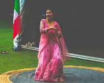 PERFORMING IN THE RAIN IN A BEAUTIFUL PINK DRESS [RAINDROPS ARE VISIBLE IN SOME PHOTOGRAPHS]-235638-1