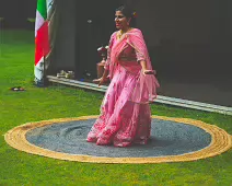 PERFORMING IN THE RAIN IN A BEAUTIFUL PINK DRESS [RAINDROPS ARE VISIBLE IN SOME PHOTOGRAPHS]-235641-1