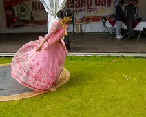 PERFORMING IN THE RAIN IN A BEAUTIFUL PINK DRESS [RAINDROPS ARE VISIBLE IN SOME PHOTOGRAPHS]-235647-1