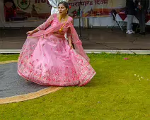 PERFORMING IN THE RAIN IN A BEAUTIFUL PINK DRESS [RAINDROPS ARE VISIBLE IN SOME PHOTOGRAPHS]-235648-1