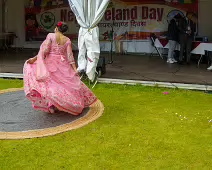 PERFORMING IN THE RAIN IN A BEAUTIFUL PINK DRESS [RAINDROPS ARE VISIBLE IN SOME PHOTOGRAPHS]-235650-1