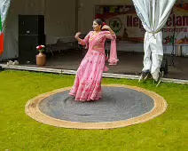 PERFORMING IN THE RAIN IN A BEAUTIFUL PINK DRESS [RAINDROPS ARE VISIBLE IN SOME PHOTOGRAPHS]-235655-1