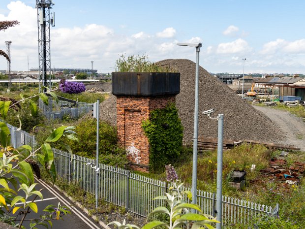 OLD WATER TOWER The disused tower features recessed panels on each elevation, a cut masonry plinth course, a cast-iron water spout on...