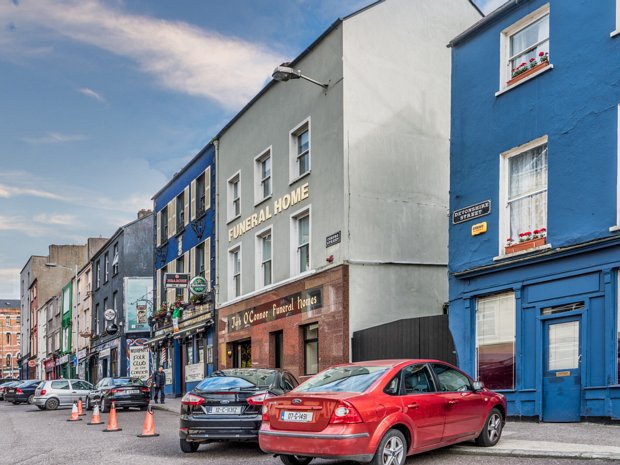 NEXT DOOR TO A FUNERAL HOME I know Coburg Street as the street where Jerh O’Connor’s Funeral Home is located next door to the Sin É Mc Cabe live...